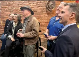  ?? ?? Sonora Mayor Mark Plummer (top, right), a candidate for District 1Tuolumne County supervisor, watches election returns with supporters Tuesday at the Sonoratap Room.