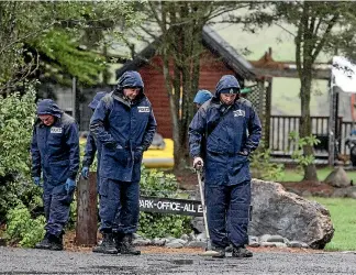  ?? PHOTO: IAIN MCGREGOR / STUFF ?? Police search for clues near the address in Hanmer Springs.