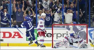  ?? CHRIS O’MEARA — THE ASSOCIATED PRESS ?? Tampa Bay Lightning left wing Ondrej Palat (18) reacts after scoring past New York Rangers goaltender Igor Shesterkin (31) during the third period in Game 3 of the Stanley Cup playoffs Eastern Conference finals on Sunday in Tampa, Fla.