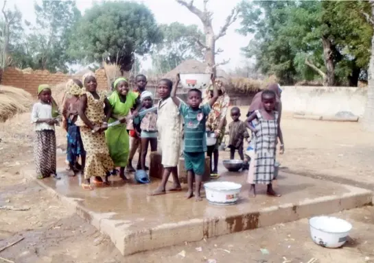  ??  ?? Children happily fetching water in a borehole in Tona, Dambatta LGA of Kano State.