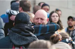  ?? DAVID ZALUBOWSKI/AP ?? Nic Grzecka, co-owner of Club Q, cries as he hugs a supporter of the LGBTQ club Wednesday in Colorado Springs, Colo. Five were killed in the attack Saturday.