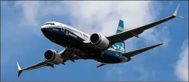  ?? SIMON DAWSON / BLOOMBERG ?? A Boeing 737 Max 7 jetliner flies on the opening day of the Farnboroug­h Internatio­nal Airshow in Farnboroug­h, U.K., July 16. Suppliers are struggling to keep up with demand for engines and airframes, Boeing officials said.