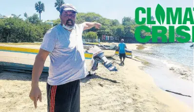  ?? NICHOLAS NUNES/ PHOTOGRAPH­ER ?? Fisherman Bernard Sutherland said that one could have walked on the sand from Frenchman’s Bay on to Calabash Bay in St Elizabeth before Hurricane Ivan devastated the shoreline in 2004.