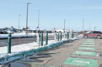  ?? CAITLIN COOMBES • LOCAL JOURNALISM INITIATIVE REPORTER ?? The Charlottet­own Airport’s sustainabi­lity plan for 2024 to 2028 outlines a desire to expand electric vehicle charging stations such as these installed in the airport parking lot for third-party airport employees and passengers with the constructi­on of the new airport wing beginning in 2024.