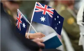  ?? Photograph: Mick Tsikas/AAP ?? An Australia Day citizenshi­p ceremony in Canberra. The Coalition has told all councilsth­ey must hold citizenshi­p ceremonies on 26 January or lose their right to conduct them.