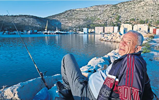  ?? ?? A fisherman in the bay of Shengjin, where the migrants would be sent