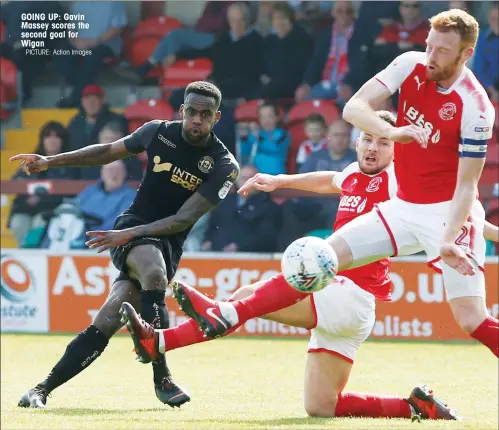  ?? PICTURE: Action Images ?? GOING UP: Gavin Massey scores the second goal for Wigan