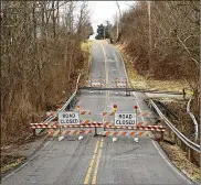  ??  ?? The Shawhan Road bridge in Warren County has been closed since a crash in early January. Neighbors say it was another crash resulting from the temptation to jump cars over the dips in the road.