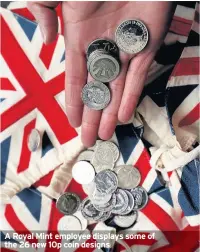  ??  ?? A Royal Mint employee displays some of the 26 new 10p coin designs