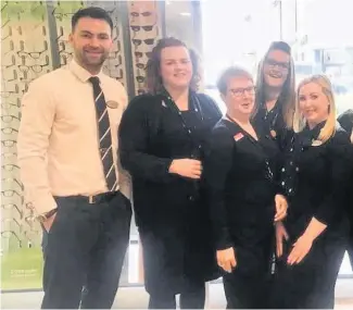  ??  ?? Raring to go The Specsavers teams at the Airdrie and Coatbridge (pictured) stores