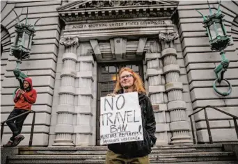  ?? Gabrielle Lurie/The Chronicle 2017 ?? Beth Kohn protests President Donald Trump's travel ban outside the Ninth U.S. Circuit Court of Appeals in San Francisco in 2017. Trump sought to eliminate the court, according to a new book.