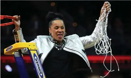  ?? Photograph: Ken Blaze/USA Today Sports ?? South Carolina head coach Dawn Staley cuts the net after the Gamecocks defeated the Iowa Hawkeyes in the women’s NCAA championsh­ip game on Sunday in Cleveland.