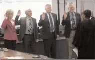  ?? CHRISTINA CORNEJO/NEWS-SENTINEL FILE PHOTOGRAPH ?? School board trustees, from left, Bonnie Cassel, Ron Heberle, George Neely and Daryl Talken are sworn into office by Judge Lauren P. Thomasson of the Superior Court of San Joaquin County on Dec. 9, 2014. Cassel and Talken have finished their final terms as board members.