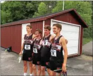 ?? JEFF STOVER — DIGITAL FIRST MEDIA ?? Boyertown’s 4x800 relay members, from left: Josh Endy, Cy Evans, Dominic DeRafelo and Payton Stanziani.