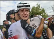  ?? (AP/Tim De Waele) ?? Slovenia’s Matej Mohoric (right) weeps as he’s congratula­ted by Italy’s Matteo Trentin after winning Friday’s 19th stage of the Tour de France in Poligny, France. More photos at arkansason­line.com/722tour23/.