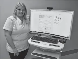  ?? ERIC MCCARTHY/JOURNAL PIONEER ?? Western Hospital Emergency Department clinical lead, Bev Ashley explains how certain patients with low-acuity issues who show up to the emergency department might be presented with the option of being seen virtually, possibly within minutes, by a doctor on a large computer monitor rather than sitting for hours in the waiting room.