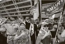  ?? LM Otero / Associated Press ?? Trump supporters recite the Pledge of Allegiance during a rally in front of City Hall in Dallas on Saturday.