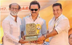  ?? — DC ?? Actors Rajinikant­h and Kamal Haasan and DMK working president M.K. Stalin at an event commemorat­ing the 75th anniversar­y of the party mouthpiece ‘Murasoli’, in Chennai on Thursday.