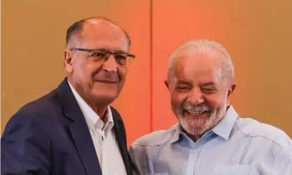  ?? Voters. Photograph: Alexandre Schneider/Getty ?? Lula, right, chose the former centre-right governor of São Paulo, Geraldo Alckmin, as his vice presidenti­al running mate to attract centrist