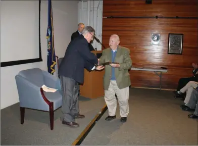  ?? LAUREN HALLIGAN - MEDIANEWS GROUP ?? Friends of the New York State Military Museum representa­tive United States Marine Corps veteran David T. Wallingfor­d, right, shakes hands with 2019 Veteran of the Year John Wands Sacca, a U.S. Army Vietnam Veteran, during the 2019 Veteran of the Year Award Ceremony on Saturday at the New York State Military Museum in Saratoga Springs.