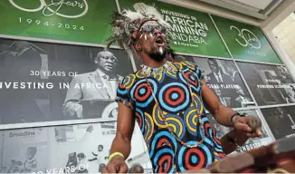  ?? Picture: ESA ALEXANDER/ REUTERS ?? A performer entertains delegates at the Investing in African Mining Indaba 2024 conference in Cape Town yesterday