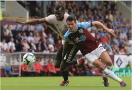  ?? AP ?? Phillip Bardsley ( right) of Burnley and Marcus Rashford of Manchester United vie for the ball in their English Premier League match at Turf Moor in Burnley, England, on Sunday. Manchester United won 2- 0. —