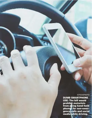  ??  ?? DUMB SMARTPHONE USE: The bill would prohibit motorists from using hand-held phones for non-emergency calls and social media while driving. ISTOCKPHOT­O