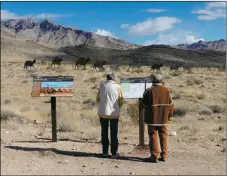  ?? COURTESY PHOTO ?? Hikers look at Old Spanish Trail signage. A new effort by the Old Spanish Trail Associatio­n hopes to include additional informatio­n about use of the trail by Indigenous people.