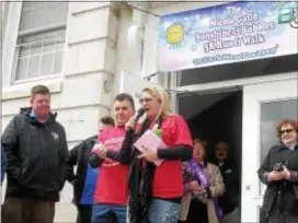  ?? KEVIN TUSTIN – DIGITAL FIRST MEDIA ?? Nicole Gallo’s parents, Donna and Stephen, speak with runners and other community members before the start of the race. Donna and Stephen presented a check to Bonner and Prendie for $22,000 for the school’s Nicole Gallo Sunshine and Bubbles scholarshi­p fund.