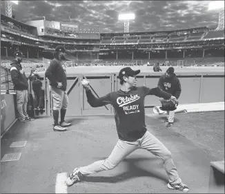  ?? Associated Press photo ?? Los Angeles Dodgers starting pitcher Kenta Maeda warms up in the bullpen during batting practice for the World Series baseball game Monday in Boston.