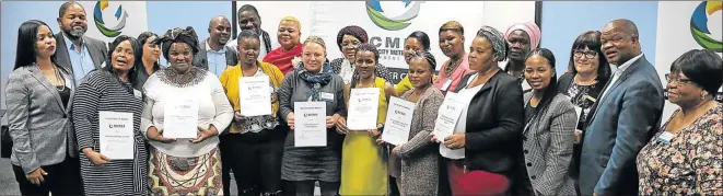  ?? Picture: MBALI TANANA ?? UPLIFTING COMMUNITIE­S: BCM Developmen­t Agency’s CEO Bulumko Nelana and marketing manager Ruweida Naina, far left, with representa­tives of the ten local organisati­ons whose community projects are benefittin­g from the agency’s R400 000 investment