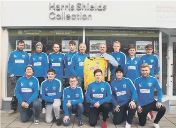  ??  ?? Mark Shields from Harris Shields Collection presents a new kit and tracksuit tops to Scalby FC’s players