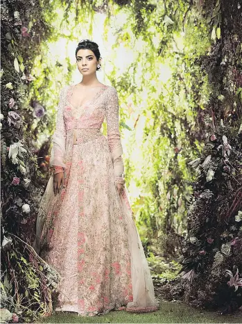  ??  ?? Leading Indian designers Shyamal &amp; Bhumika debuted their Bridal Couture collection at Surrey’s House of Raina, which Shyamal Shodhan calls “one of the most exquisite couture stores in the region.”