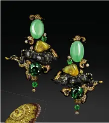  ?? Clockwise, from top left: Brooch with rubies, onyx and white and fancy coloured diamonds; earrings in yellow gold with onyx, green tourmaline­s, jade, emeralds and fancy yellow diamonds; brooch with jade, orange, fancy orange and champagne diamonds, all by ??