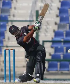  ?? Ravindrana­th K / The National ?? Mohammed Usman struck 32 runs for the UAE as the batsmen struggled on a soggy pitch yesterday