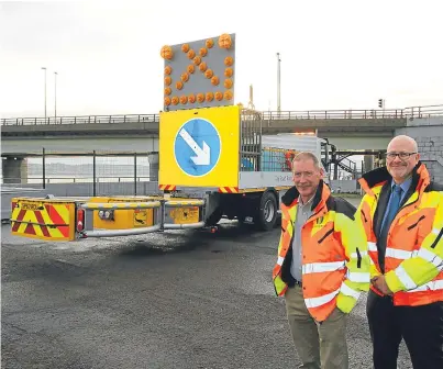 ?? Picture: Gareth Jennings. ?? Alan Hutchison, bridge manager, and Neil Fergusson, transport manager, with the new impact protection vehicle which the public can help name on Twitter.
