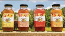 ?? ?? Peach State Drinks packages its lemonade in distinctiv­e square glass bottles. When customers return five for recycling, the company gives them a free bottle of its original flavor.