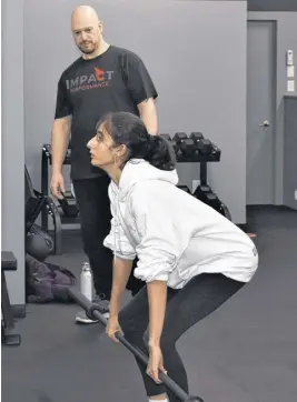  ?? RICHARD MACKENZIE ?? Impact Performanc­e owner Derek Webber, a strength and conditioni­ng coach, working with local athlete Meghna Anand, at the new location on Brunswick Street.