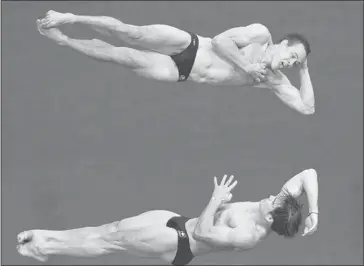  ?? Tyler Anderson/postmedia Olympic Team ?? Alex Despatie, bottom, and Reuben Ross, top, compete in the men’s synchroniz­ed three-metre springboar­d final, Wednesday. The pair finished sixth, despite an enforced lack of practice, while a duo from China took the gold.