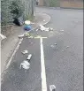  ??  ?? Neighbours in Almond Close say they have to clean their street after the bin lorry visits each week