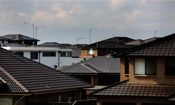  ?? Photograph: Jessica Hromas/The Guardian ?? NSW planning minister Rob Stokes says there are “no practical reasons why we shouldn’t be ditching dark roofing on new homes”.