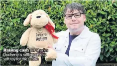  ??  ?? Raising cash DJ Charles Docherty is raffling off this soft toy for the centre