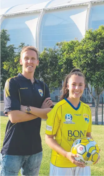  ?? Picture: SUPPLIED ?? Michael Thwaite and Bronti Hodgkinson at Cbus Super Stadium today. And (below) Hodgkinson heads on to the pitch in 2010 for an A-League fixture.