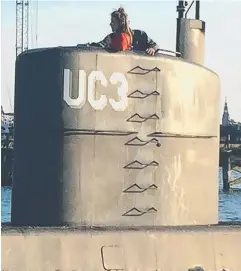  ??  ?? Journalist Kim Wall standing in the tower of the private submarine "UC3 Nautilus".