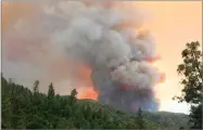  ?? AP PHOTO BY CARRIE ANDERSON ?? The Ferguson Fire burns near Yosemite National Park on Sunday, July 15, as seen from El Portal.