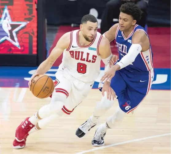  ?? MITCHELL LEFF/GETTY IMAGES ?? Guard Zach LaVine (dribbling past the 76ers’ Matisse Thybulle on Friday) needs All-Star votes from coaches who might not have seen him play yet this season.