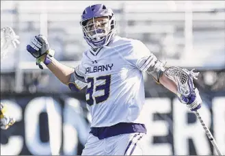  ?? Photos by Hans Pennink / Special to the Times Union ?? Ualbany's Ron John missed the Danes’ opener because of COVID-19 protocols, but played in last week’s 16-6 win over Hartford, scoring three goals with two assists.