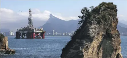  ?? DAVID SILVERMAN/GETTY IMAGES FILES ?? An oil drilling platform is shown in Rio de Janeiro. The Canadian oilpatch is seen to be in better shape than a year ago, with projected competitio­n for longer cycle projects.