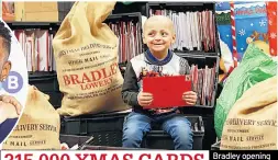  ??  ?? Bradley opening piles of messages 315,000 XMAS CARDS