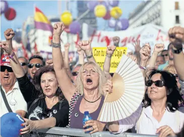  ?? REUTERS ?? People take part in a meeting of Podemos (We Can) party at Madrid’s Puerta del Sol square, Spain, on Saturday.